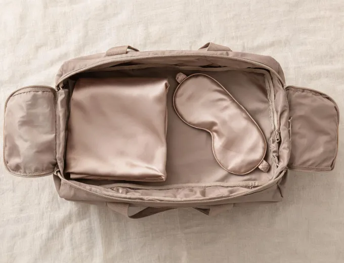 Silk travel kit packed in a weekend bag
